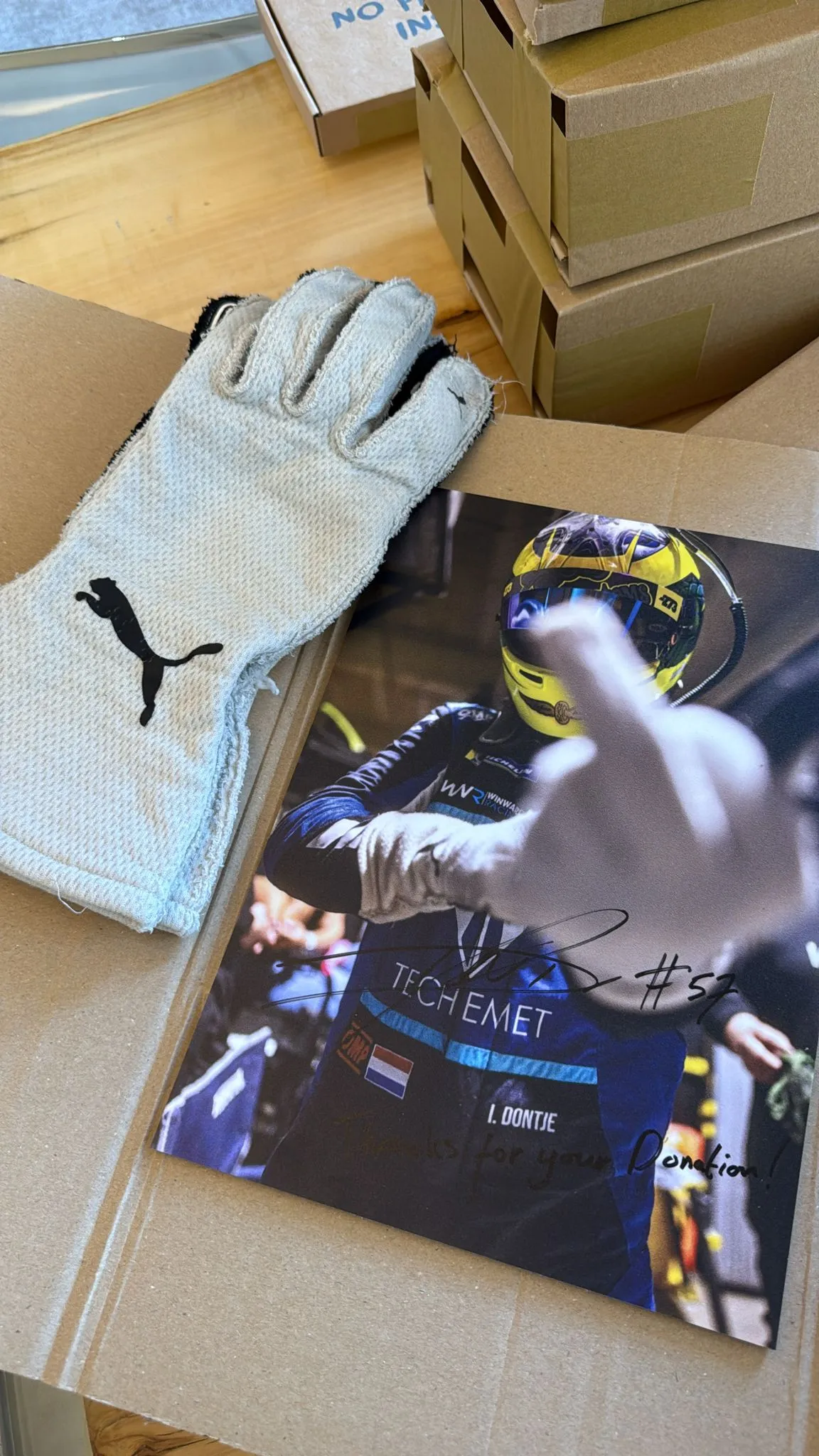 Indy Dontjes race-gloves and a signed photo